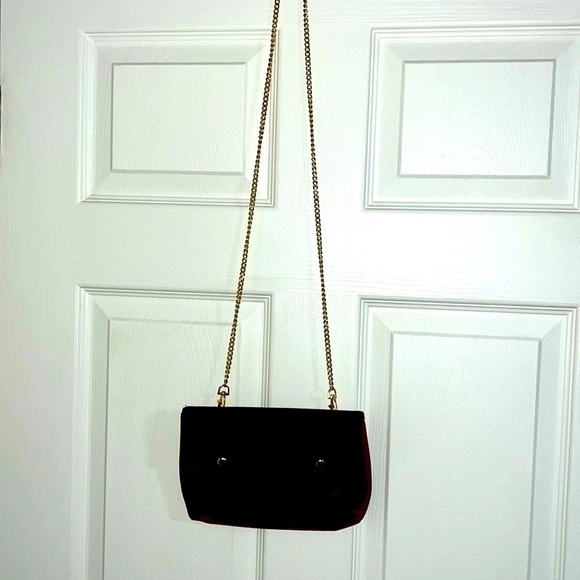 Guess Women’s Burgandy evening purse with chain strap and metal front snap. - Picture 9 of 10